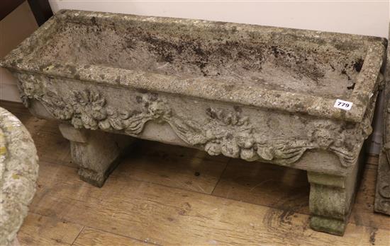 A composition stone trough W.90cm